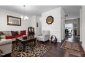 Inviting living room featuring hardwood floors, neutral walls, and comfortable seating arrangement at 1055 Kerr St, Burlington, NC 27215