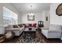 Inviting living room featuring hardwood floors, neutral walls, and comfortable seating arrangement at 1055 Kerr St, Burlington, NC 27215