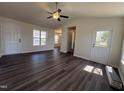 Bright living room with high ceilings and modern dark wood flooring at 1104 Thelonious Dr, Raleigh, NC 27610