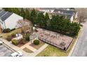 Community playground and gazebo surrounded by greenery and a walking path at 116 Anterbury Dr, Apex, NC 27502