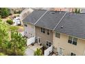 Back exterior view showcasing a private patio and well-maintained yard at 116 Anterbury Dr, Apex, NC 27502
