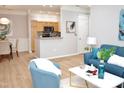 Open-concept living space seamlessly connecting the dining area, kitchen, and living room at 1301 Durlain Dr # 108, Raleigh, NC 27614