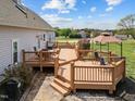Multi-tiered wooden deck with seating provides a great space for outdoor gatherings at 1408 Harvey Johnson Rd, Raleigh, NC 27603