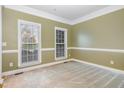 Cozy bedroom with natural light, neutral tones, and spacious layout at 205 Quarryrock Rd, Holly Springs, NC 27540