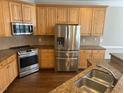 Kitchen features stainless steel appliances and granite countertops at 3709 Valley Pine Ct, Wendell, NC 27591