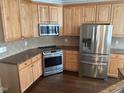 Kitchen features stainless steel appliances and granite countertops at 3709 Valley Pine Ct, Wendell, NC 27591