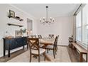 Elegant dining room with a wooden table, stylish chandelier, and decor at 724 Summer Music Ln, Raleigh, NC 27603