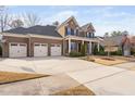 Spacious home with a three-car garage and a sprawling front yard at 832 Mountain Vista Ln, Cary, NC 27519
