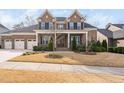 Beautiful brick home showcasing a well-manicured lawn and inviting entrance at 832 Mountain Vista Ln, Cary, NC 27519