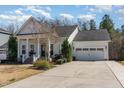 Beautiful house with a 2-car garage and a well-kept lawn and landscaping at 862 Legacy Falls S Dr, Chapel Hill, NC 27517