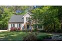 Charming two-story home with green shutters and a beautifully maintained front yard at 902 Loop Rd, Clayton, NC 27527