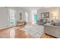 Bright living room with hardwood floors, neutral paint, and lots of natural light at 902 Loop Rd, Clayton, NC 27527