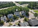 Aerial view of the home, located near the woods and a major thoroughfare at 957 Vandalia Dr, Cary, NC 27519