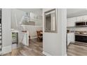 The entryway features elegant staircase and updated kitchen with stainless steel appliances and granite counters at 100 Hunting Chase # 1-B, Cary, NC 27513