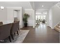 Spacious foyer with elegant hardwood floors and neutral walls, creating a welcoming entrance to the home at 1212 Stonemill Falls Dr, Wake Forest, NC 27587