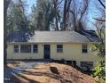Inviting home with a new roof and gravel walkway, nestled on a landscaped lot at 123 Barclay Rd, Chapel Hill, NC 27516