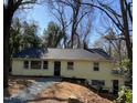 Quaint home showcasing fresh paint, a dark roof, and meticulous landscaping at 123 Barclay Rd, Chapel Hill, NC 27516