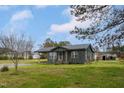 Inviting single-story house with a covered carport and mature trees at 1239 Brogden Rd, Smithfield, NC 27577