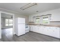 Functional kitchen equipped with white appliances, plenty of cabinet space, and durable countertops at 1239 Brogden Rd, Smithfield, NC 27577