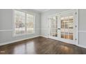 Bright office with hardwood floors, large window and glass doors to a secondary room at 12404 Brandon Hall Dr, Raleigh, NC 27614