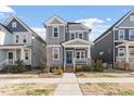 Charming two-story home with a well-maintained yard and inviting front porch at 1312 Big Falls Dr, Wendell, NC 27591