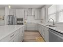 Bright kitchen featuring stainless steel appliances, gas range, and designer countertops at 175 Norwell Ln, Pittsboro, NC 27312