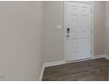Clean entryway features a white door, gray walls, and wood-look floors at 176 Starlight St, Sanford, NC 27330