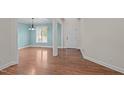 Inviting dining room with hardwood floors, soft blue walls, and elegant chandelier at 2505 Egypt Mountain Rd, Kittrell, NC 27544