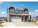 Charming two-story home boasting stone accents, a covered porch, and a spacious two-car garage at 251 North Crest Dr, Chapel Hill, NC 27517