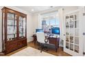Inviting office space features a large window, hardwood floors, and a beautiful display cabinet at 251 North Crest Dr, Chapel Hill, NC 27517