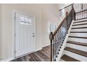Welcoming entryway with staircase and wood-look flooring at 3162 Retama Run # 231, Apex, NC 27562