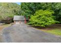 Home's exterior with a two-car garage and large driveway at 4811 New Sharon Church Rd, Hillsborough, NC 27278