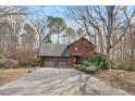 Attractive brick home with a two-car garage and a paved driveway at 4811 New Sharon Church Road, Hillsborough, NC 27278