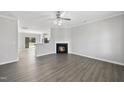 Bright living room featuring vinyl plank flooring and a fireplace at 54 Silverleaf Dr, Wendell, NC 27591