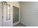 Close-up of a front door with unit number 204 next to a window at 6001 Winterpointe Ln # 204, Raleigh, NC 27606