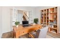 Home office space featuring a wooden desk, chair, bookcase, and french doors at 65 Hickory Run Ln, Franklinton, NC 27525