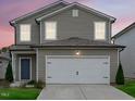 Charming two-story home with a two car garage, neutral siding, and well-maintained landscaping at 656 Dallas Rose Dr, Wendell, NC 27591