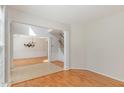 Open concept living space with hardwood floors, and lots of natural light, perfect for entertaining at 7533 Silver View Ln, Raleigh, NC 27613