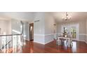 Bright dining area with hardwood floors and a modern chandelier at 918 Templeridge Rd, Wake Forest, NC 27587