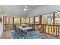 Cozy screened porch with outdoor seating and a ceiling fan at 918 Templeridge Rd, Wake Forest, NC 27587