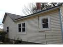 A view of the side of the home with traditional siding, windows, and trim details at 1005 N Wilson Ave, Dunn, NC 28334