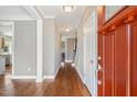 Bright entryway with hardwood floors, neutral walls, and a glimpse into the home's interior at 1024 Jensen Grove Ct, Fuquay Varina, NC 27526