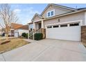 A well-maintained home featuring a two-car garage and manicured landscaping and a welcoming front entrance at 105 Olde Liberty Dr, Youngsville, NC 27596