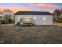 Home's backyard with deck features a blank canvas for outdoor living and enjoyment at 111 Faucette Ave, Burlington, NC 27215