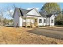 Inviting one story home with covered front porch and freshly installed driveway at 111 Faucette Ave, Burlington, NC 27215
