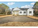 Charming one story home features a welcoming front porch and spacious front yard at 111 Faucette Ave, Burlington, NC 27215
