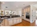 Spacious kitchen boasts granite countertops, a gas cooktop, and modern stainless steel appliances at 116 Galway Dr, Chapel Hill, NC 27517