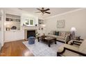 Inviting living room with a cozy fireplace and built-in shelving offers a warm and stylish space at 116 Galway Dr, Chapel Hill, NC 27517