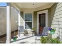 Inviting covered porch with comfortable seating, offering a relaxing outdoor space at 1407 Palmer Hill Dr, Durham, NC 27703