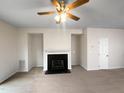 Bright living room with a fireplace, ceiling fan, and neutral-colored walls at 2013 Turtle Point Dr, Raleigh, NC 27604